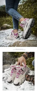 Detail of multi-color outdoor hiking boots with rugged anti-slip sole on snowy terrain