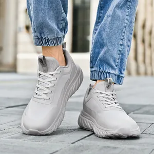 Lightweight breathable running shoes in light grey mesh, shown on foot in urban setting
