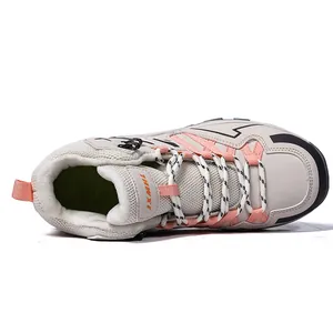 Winter outdoor hiking boots in light grey and pink with warm fleece lining and sturdy soles
