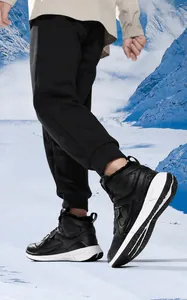 Detail view of high-top outdoor snow boots featuring thick faux fur lining and cushioning