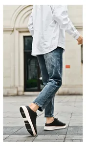 Close-up of black leather casual shoes with non-slip soles and stylish brown trim