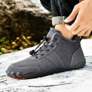 Men's dark grey winter snow boots with warm faux fur lining and anti-slip sole on snow