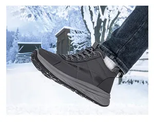 Close-up of winter boots with thick non-slip soles and warm lining in a snowy scene