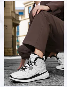 Detail view of high-top winter sneakers featuring warm plush lining and stylish color blocking