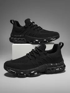 Detail of breathable black mesh sneakers showing translucent air cushion and TPU support
