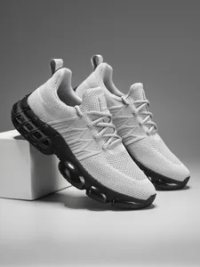 Close-up of breathable knit upper and cushioned sole on a modern grey running shoe