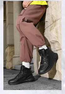 Detail of high-top winter sneakers featuring warm faux fur lining and thick rubber soles