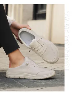 Detail view of cream leather backless mules with non-slip thick soles and metal buckle