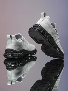 Detailed side view of breathable gray mesh sneakers with modular black cushioning soles