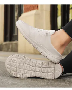 Close-up of lightweight beige mule sneakers with quilted leather and anti-slip thick soles
