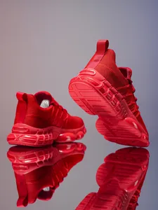 Detail of red breathable mesh running shoe with thick non-slip split sole texture