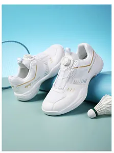 Detail of white indoor badminton shoes with dial lacing system and breathable mesh texture