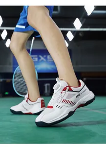 Macro view of indoor badminton shoes featuring a quick-dial lacing system and breathable mesh