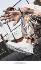 Macro detail of breathable mesh fabric and chunky wave sole on white running sneakers