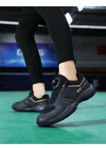 Close-up of indoor court shoes featuring a twist buckle system and breathable mesh texture