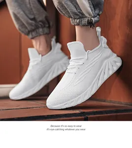 Side view of white mesh running shoes worn by a model on a brick background