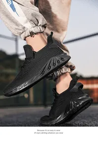 Detail view of black knitted running shoes with thick hollowed-out shock-absorbing soles