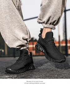 Macro detail of breathable knitted mesh fabric on men's lightweight black running shoes