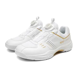 Breathable white badminton shoes with gold accents and a rotary knob lacing system