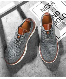 Detailed top view of grey knit casual shoe with brown leather accents and white sole