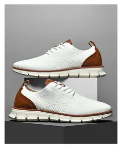 Detail of white flyknit sneakers with brown leather heel and classic brogue patterns