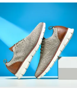 Close-up of khaki breathable knit mesh men sneakers with leather details on blue background