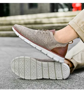 Outdoor close-up of khaki mesh knit sneaker with brown leather detail and white sole