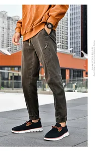 Detail view of corduroy jogger pants with elastic cuff and utility pocket design