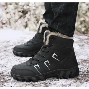 Detail of black winter high-top boots featuring warm faux fur lining and rugged rubber soles