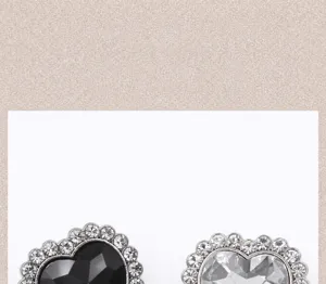 Detail of heart-shaped metal buttons with sparkling rhinestones and crystal center