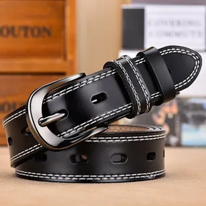 Detail of black leather belt featuring white contrast stitching and gunmetal alloy buckle