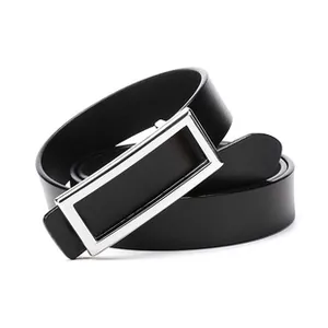 Detailed macro view of the silver rectangular metal buckle on a black leather belt