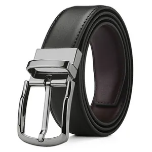 Detail of premium men's leather belt showing silver buckle and reversible texture
