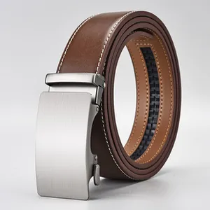 Detail of men's brown leather belt with contrast stitching and silver brushed metal buckle