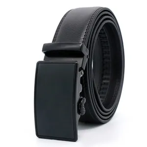 Detail of men's black leather belt with lychee texture and matte automatic buckle