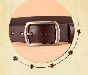 Macro shot of silver pin buckle and dark brown genuine leather belt texture with holes