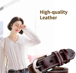 Detail of dark brown leather belt for women showing double stitching and silver metal buckle