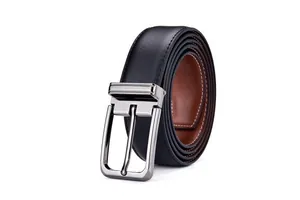 Detailed macro view of the silver pin buckle and dual-sided leather belt stitching