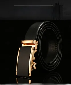 Macro detail of men's black lychee leather belt with luxury gold automatic buckle