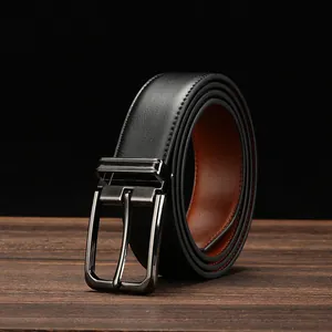 Close-up of a premium black leather business belt with a gunmetal textured buckle