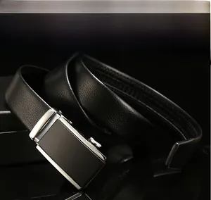 Detail of black leather belt with lychee texture and silver automatic metal buckle