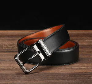 Macro detail of men's leather belt with classic pin buckle on dark wood background