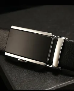Close-up of men's business belt with silver alloy automatic buckle and black lychee texture