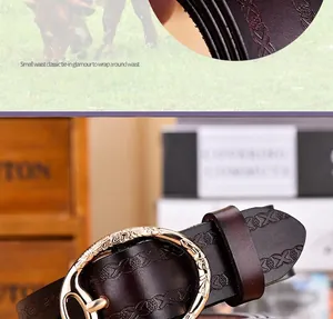 Close-up of vintage embossed leather belt with golden floral buckle and textured finish