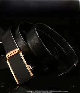 Detail of black leather business belt with lychee texture and gold-rimmed automatic buckle