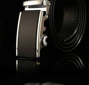 Detailed macro view of silver metallic automatic buckle and textured black leather belt strap