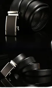 Detail of black business belt with litchi grain leather texture and alloy automatic buckle