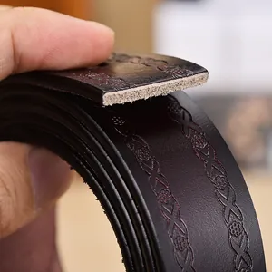 Deep brown leather belt for women featuring floral embossing and a thick cowhide texture