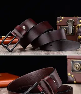 Detailed macro view of dark brown leather belt with matte black metal pin buckle closure