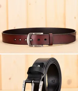 Close-up of classic men leather belts with pin buckles in black and dark brown